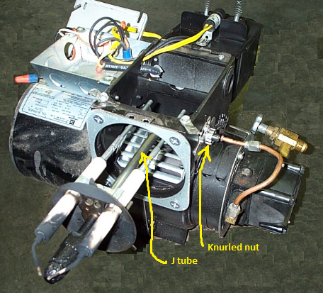 J tube in nozzle assembly